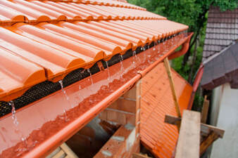 Clay colored roof with drainage system