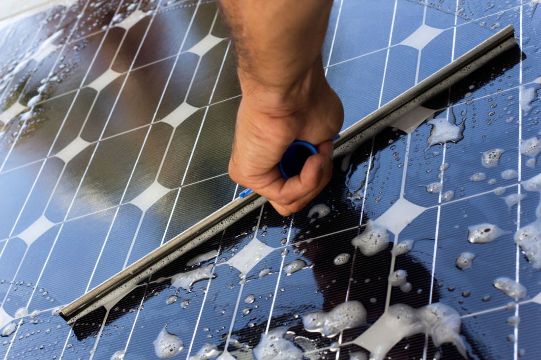 Sudsy solar power system and squeegee